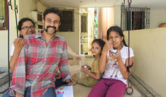 Chetana, Karthik, Disha and Khiyali on the porch swing.