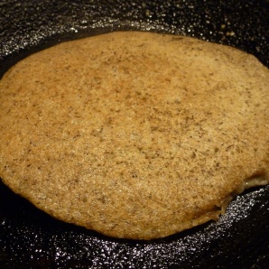 Flip dosa after the first side cooks. Dosa made of amaranth, rice and urad dal (in equal parts).